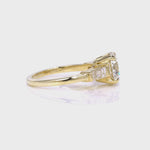 Baguette Three Stone Round Engagement Ring in Yellow Gold