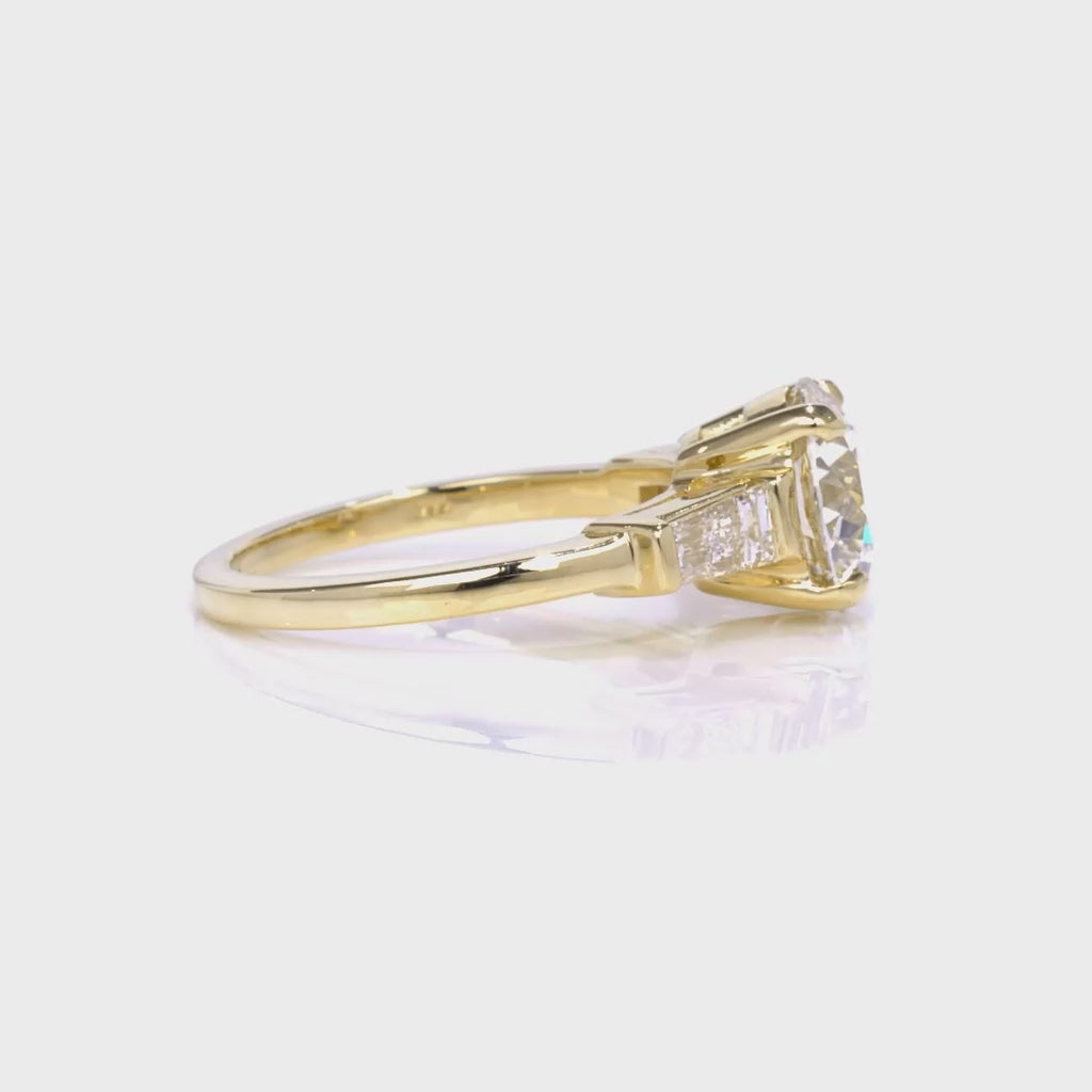 Baguette Three Stone Round Engagement Ring in Yellow Gold