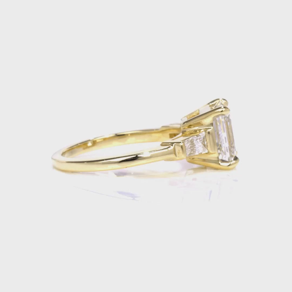 Baguette Three Stone Emerald Engagement Ring in Yellow Gold