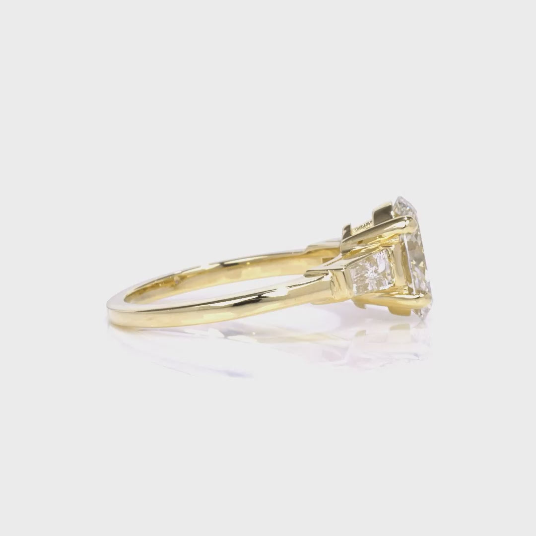 Baguette Three Stone Oval Engagement Ring in Yellow Gold