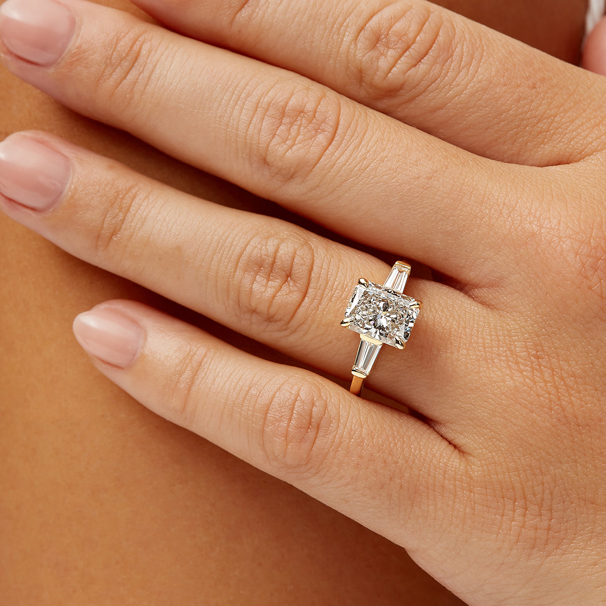 Baguette Three Stone Long Radiant Engagement Ring in Yellow Gold