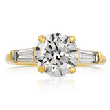 Baguette Three Stone Round Engagement Ring in Yellow Gold