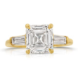 Baguette Three Stone Emerald Engagement Ring in Yellow Gold