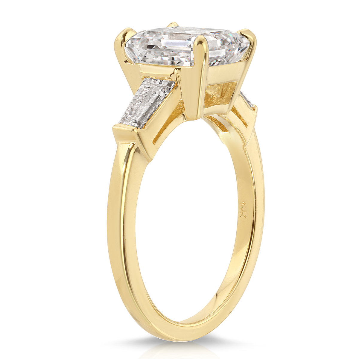 Baguette Three Stone Emerald Engagement Ring in Yellow Gold