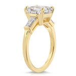 Baguette Three Stone Emerald Engagement Ring in Yellow Gold