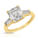 Baguette Three Stone Emerald Engagement Ring in Yellow Gold